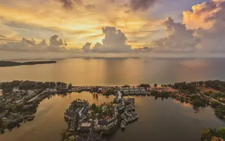 Phuket property: drone view at sunset of developments in Laguna, Bang Tao