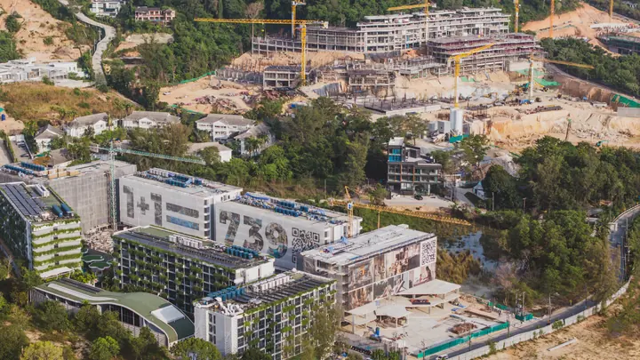 Drone footage of residential projects under construction in Layan, Phuket, at different stages of completion.