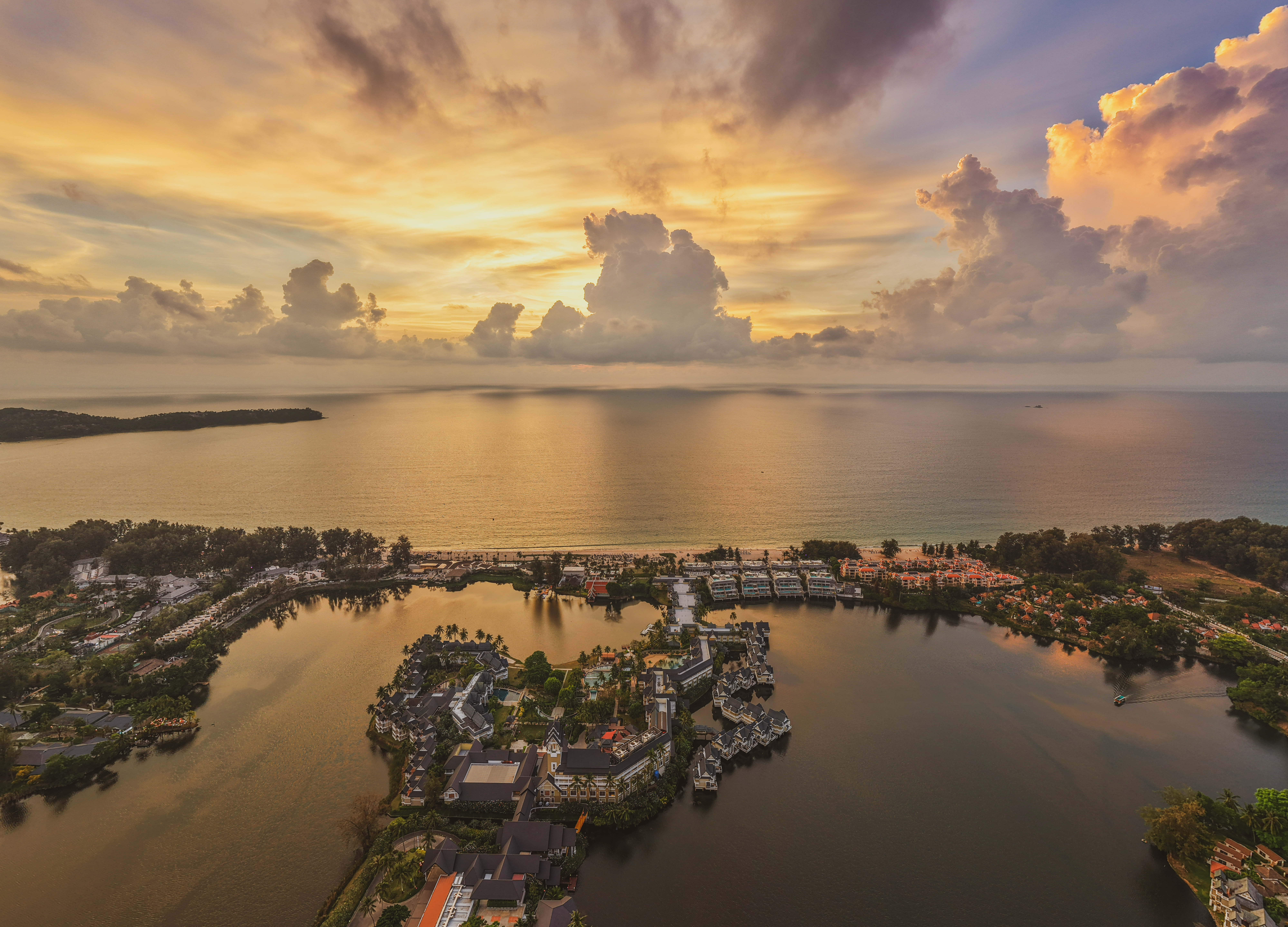 Phuket property: drone view at sunset of developments in Laguna, Bang Tao